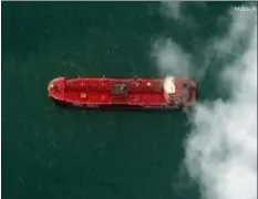  ?? SATELLITE IMAGE ©2019 MAXAR TECHNOLOGI­ES VIA AP ?? This Monday Maxar Technologi­es shows a close up of British-flagged oil tanker Stena Impero at the Iranian port city of Bandar Abbas. President Hassan Rouhani suggested last Wednesday that Iran might release the U.K.-flagged ship if Britain takes similar steps to release an Iranian oil tanker seized by the British Royal Navy off Gibraltar earlier this month. His remarks could create an opening to reduce tensions as Boris Johnson becomes prime minister.