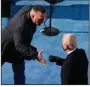  ?? (AP/Susan Walsh) ?? Country singer Garth Brooks reaches out to congratula­te President Joe Biden after singing Amazing Grace on Wednesday.