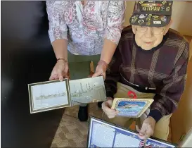  ?? PHOTOS BY MARAH MORRISON — THE NEWS-HERALD ?? Bob Smolik, a 94-year-old United States Navy veteran, was one of the many area veterans visited during the Geauga County Department on Aging’s Veterans Honor Stop.