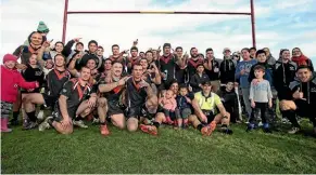  ??  ?? The Cowboys team and supporters enjoy their win in the Southland Rugby League Final in Invercargi­ll on Saturday. Photo: KAVINDA HERATH/STUFF