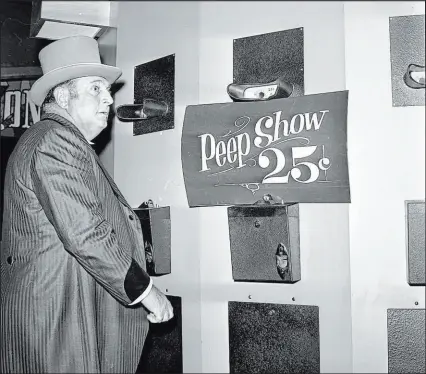  ?? ?? Jay Sarno views the topless peep show, cost just 25 cents, at his newly opened Circus Circus.