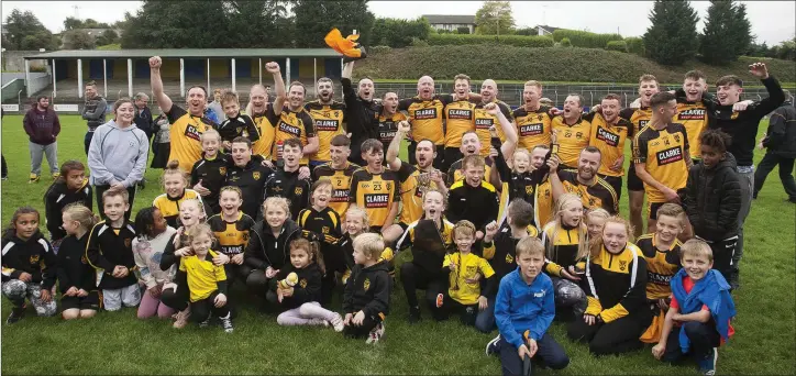  ??  ?? Ashford players and supporters celebrate in style after defeating Tinahely to claim the Junior ‘C’ football crown at Pearse’s Park, Arklow.