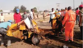  ??  ?? MAIDUGURI: People clear debris after an explosion. — AP