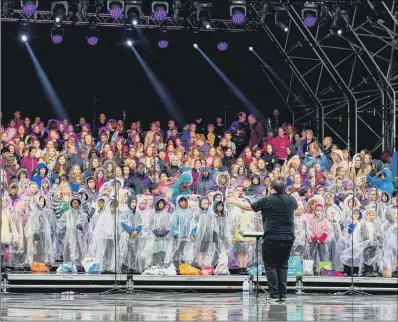  ??  ?? Children sing at the Piece Hall in Halifax yesterday in the revival of an old tradition.