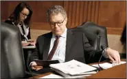  ?? RON SACHS/CNP ?? U.S. Sen. Al Franken (D-Minn.) looks over his notes on Nov. 29 on Capitol Hill in Washington, D.C. Franken announced his resignatio­n from the Senate over sexual misconduct allegation­s on Thursday.