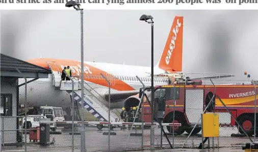  ??  ?? DRAMA: Fire, ambulance and police were scrambled to Inverness Airport after the easyJet flight was forced into an emergency landing