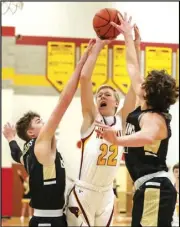  ?? Staff photo/Jake Dowling ?? New Bremen’s David Homan attempts a contested shot during Saturday’s non-conference boys basketball game against Botkins.