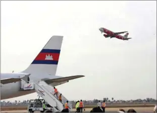  ?? HENG CHIVOAN ?? A plane takes off from Phnom Penh Internatio­nal Airport in 2013.