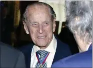  ?? JOHN STILLWELL — POOL PHOTO VIA AP ?? Britain’s Prince Philip, the Duke of Edinburgh speaks to guests after attending the Order of Merit service at Chapel Royal in St James’s Palace, London, Thursday. Prince Philip, the consort known for his constant support of his wife Queen Elizabeth II...