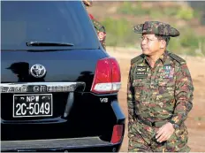  ?? LYNN BO BO/ GETTY IMAGES ?? Myanmar’s military commander- in- chief Senior Gen. Min Aung Hlaing arrives to attend joint military exercises near Pathein city on Friday. The Myanmar government denies reports that mass graves have been found in the country.