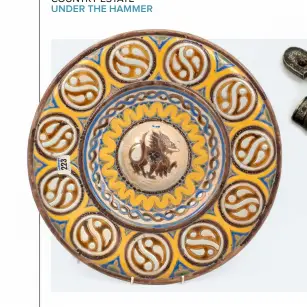  ?? ?? Above, from left: the writer believes this late-19thcentur­y Spanish plate to be Seville; this Caucasian kindjal with 13.25in blade fetched £400; a Joseph Egg 20-bore flintlock pistol and companion ‘Baby Egg’ is one of the star lots at Holts’ November sale