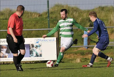  ??  ?? Glen McCormack in action for Strand Celtic against Carbury on Sunday. Pics: Carl Brennan.