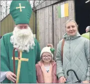  ?? (Photo: Katie Glavin) ?? St Patrick (William Murphy) pictured with Emily and Orinta Dempsey at the St Patrick’s Day parade held at Glennon Brothers’ site.