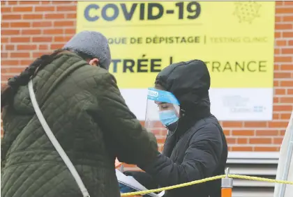  ?? PIERRE OBENDRAUF ?? People arrive for COVID-19 testing at CLSC de Parc-extension on Tuesday, the first day in weeks that Quebec dipped below 1,000 daily diagnoses. The new case count was back up to nearly 1,200 on Wednesday. The stress of coping with the pandemic is taking its toll, says Allison Hanes.