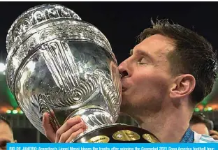  ??  ?? RIO DE JANEIRO: Argentina’s Lionel Messi kisses the trophy after winning the Conmebol 2021 Copa America football tournament final match against Brazil at Maracana Stadium in Rio de Janeiro, Brazil, on Saturday. — AFP