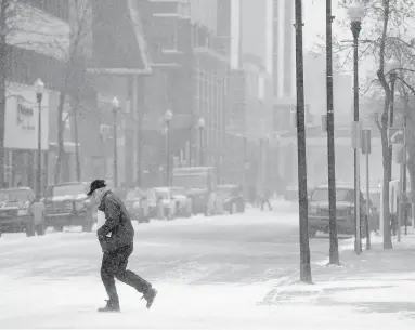  ??  ?? High winds and falling snow made for low visibility in Regina and southern Saskatchew­an.