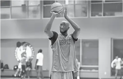  ?? BOSTON GLOBE VIA GETTY ?? Boston Celtics rookie center Tacko Fall works on his shooting during a practice session at the Auerbach Center on July 1.