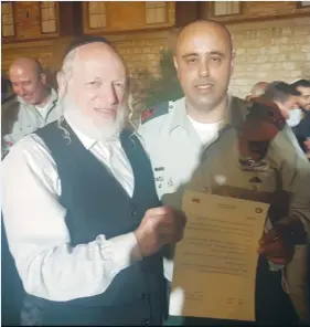  ?? (ZAKA) ?? ZAKA FOUNDER Yehuda Meshi Zahav with former IDF Home Front Command head Maj.Gen. Tamir Yadai.