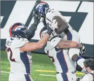  ?? SETH WENIG — ASSOCIATED PRESS ?? Broncos running back Melvin Gordon, aloft, celebrates with Garett Bolles, left, and Dalton Risner after scoring a touchdown during the second half of Thursday night’s game against the Jets in East Rutherford, N.J.