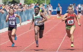  ?? BOB TYMCZYSZYN
THE ST. CATHARINES STANDARD ?? From left, A.N. Myer’s Nina Shaik, Holy Cross’ Chidera Onyegbule and Governor Simcoe’s Mia Friesen in the junior girls 100 at the Southern Ontario Secondary Schools Associatio­n track and field championsh­ips Thursday at St. Catharines.