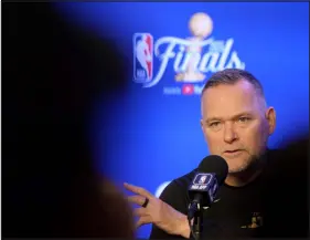  ?? HYOUNG CHANG — THE DENVER POST ?? Nuggets coach Michael Malone answers questions after practice ahead of the NBA Finals against the Miami Heat on Wednesday at Ball Arena.