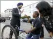  ?? JULIO CORTEZ — THE ASSOCIATED PRESS ?? New Jersey Attorney General Gurbir Grewal, left, greets Jasim Jackson, 9, after a news conference announcing pollution lawsuits filed by the state, Wednesday in Newark.