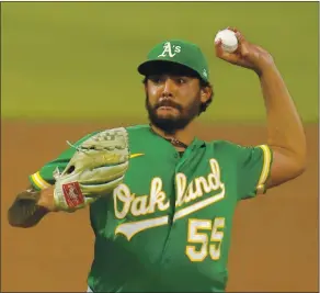  ?? JACK DEMPSEY — THE ASSOCIATED PRESS ?? Left-hander Sean Manaea, who had a similar surgery as teammate Matt Chapman in 2013 and came back to be a key starter for the A’s, delivers a pitch against the Colorado Rockies.
