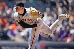  ?? DAVID ZALUBOWSKI — THE ASSOCIATED PRESS ?? The Giants’ pitcher Logan Webb works against the Colorado Rockies in the first inning Wednesday.