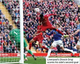  ?? ?? Liverpool’s Divock Origi scores his side’s second goal