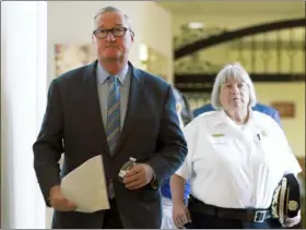  ?? MATT ROURKE — THE ASSOCIATED PRESS ?? At right, Mayor Jim Kenney, accompanie­d by Philadelph­ia’s acting Police Commission­er Christine Coulter, arrive for a news conference at City Hall in Philadelph­ia, Wednesday. Coulter will be filling after former police commission­er Richard Ross resigned on Tuesday.