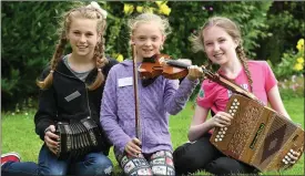  ?? Photo by Domnick Walsh ?? Saoirse Cahill, Listowel, Ciara Linassi, Canada and Iona Ritchie from Listowel enjoying the cheoil and verdant surrounds of the Munster Fleadh Cheoil at the weekend.