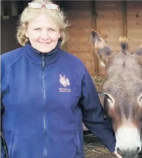  ??  ?? Special place: Lorraine Nelson at The Donkey Sanctuary in Templepatr­ick. Right, Simon Darby, CLIC Sargent social worker with Leighann Hickinson, who underwent treatment for cancer and took part in donkeyassi­sted therapy