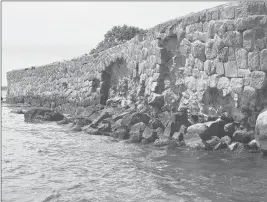  ??  ?? Much of Enders Island is fortified by a rock wall.