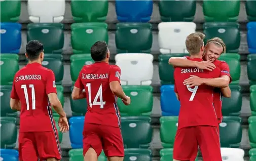  ??  ?? Dynamic duo… Haaland and Sorloth celebrate Norway’s fifth goal in Belfast