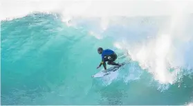  ?? Picture: WSL ?? SMOOTH RIDE: Mick Fanning, of Australia, pumping at Supertubes