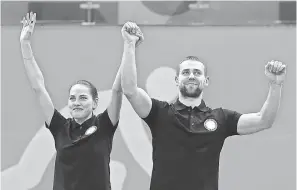  ??  ?? The Court of Arbitratio­n for Sports has opened a positive doping test investigat­ion of Russia’s Aleksandr Krushelnit­ckii. He won bronze in mixed doubles curling with his wife, Anastasia Bryzgalova. SOOBUM IM/USA TODAY SPORTS