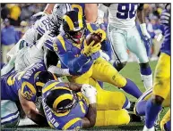  ?? AP/MARCIO JOSE SANCHEZ ?? Los Angeles Rams running back C.J. Anderson scores a touchdown in the first half of the Rams’ victory Saturday over the Dallas Cowboys in the NFC divisional playoffs. The Rams rushed for 273 yards, including 123 yards by Anderson.