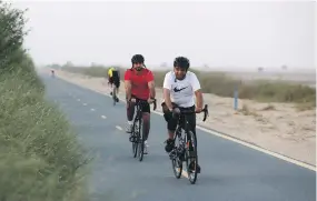  ?? Pawan Singh / The National ?? Cyclists on Al Qudra cycle track in Dubai