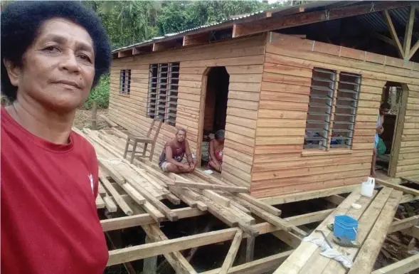  ?? ?? Republic of Fiji Military Forces Corporal Marica Kotobalavu’s aunt, Losena Salusaluni­toba, pictured outside the nearly-completed three-bedroom house that she’s building for her parents in Navonu, Vanua Levu.