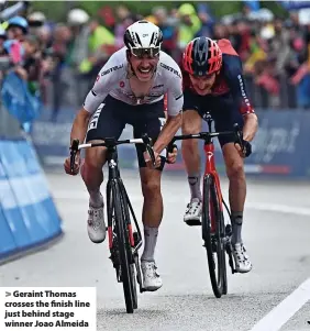  ?? ?? > Geraint Thomas crosses the finish line just behind stage winner Joao Almeida