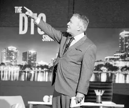  ?? JOE BURBANK/STAFF PHOTOGRAPH­ER ?? Orlando Mayor Buddy Dyer acknowledg­es the audience in the balcony of Ace Cafe Orlando on Wednesday while taping “The DTO Show,” his presentati­on of the annual “State of Downtown” address, using the format of a late-night-TV talk show.