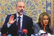  ?? Reuters ?? Jordan’s Prime Minister Omar Al Razzaz and Minister of State for Media Affairs Jumana Gunaimat arriving for a news conference in Amman last June 19.