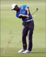  ?? JOHN AMIS — THE ASSOCIATED PRESS ?? Tiger Woods hits from the first fairway during the third round of the Tour Championsh­ip golf tournament Saturday in Atlanta.