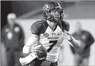  ?? AP/DAVID J. PHILLIP ?? Missouri quarterbac­k Maty Mauk has completed 53 percent of his passes and thrown for 1,784 yards and 19 touchdowns for the Tigers, who need a victory today against Tennessee to remain atop the SEC East standings.