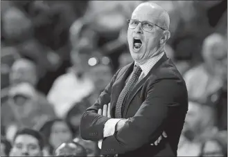  ?? KAREEM ELGAZZAR/THE CINCINNATI ENQUIRER/AP PHOTO ?? In this Jan. 1 file photo, UConn coach Dan Hurley shouts during the first half of the team’s game against Cincinnati in Cincinnati.