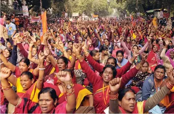  ?? — PTI ?? Bharatiya Mazdoor Sangh workers hold a demonstrat­ion against the government during a during at Parliament street, in New Delhi on Friday.