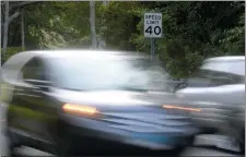  ?? TIM MARTIN/THE DAY ?? Motor vehicles travel on Route 117 Sunday in Ledyard. Several areas in town have new signs for faster speed limits.