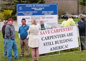  ?? SEAN D. ELLIOT/THE DAY ?? Union carpenters hold a rally to save the carpentry program at the Ella T. Grasso Technical High School in Groton on Friday.