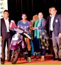  ??  ?? Super League Women’s Best Player Deepika Bandara on the scooter she received