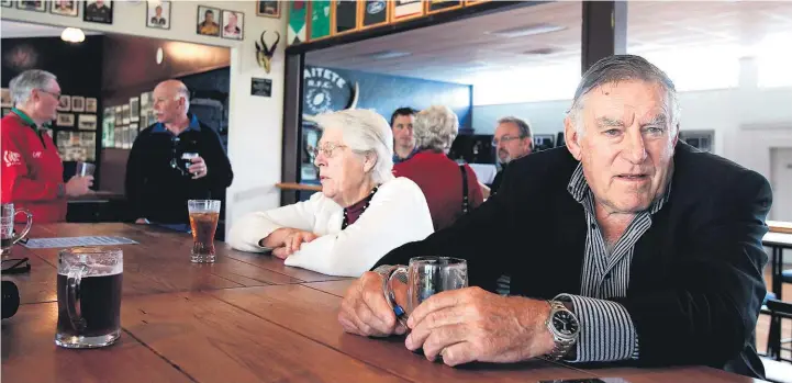  ?? Christine Cornege ?? A familiar man in a familiar pose in a familiar setting — Colin Meads at the Waitete Rugby Club with wife Verna.